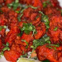 Chicken 65 · Boneless chicken marinated in traditional Indian spices and batter fried.