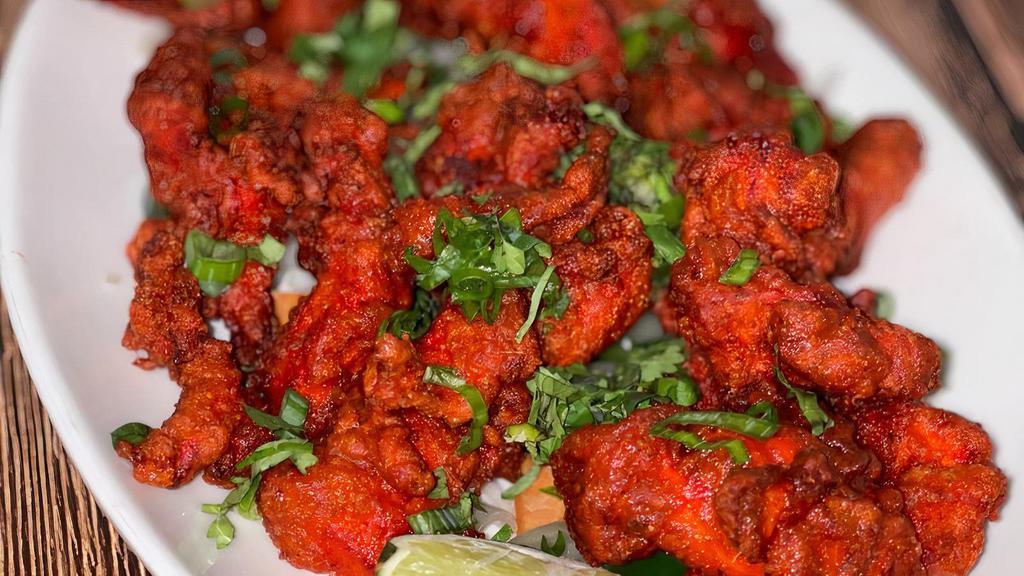Chicken 65 · Boneless chicken marinated in traditional Indian spices and batter fried.
