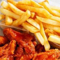 Buffalo Wings · Six piece wings tossed with buffalo sauce. Served with ranch sauce and french fries.