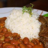 Beef Stew · Sliced beef slows cooked with mixed vegetables and fresh herbs. Served with rice, beans, and...