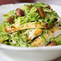 Caesar Salad With Chicken · Romaine lettuce tossed with traditional dressing, croutons, Parmesan cheese, and sliced gril...