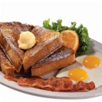 French Toast Combo · Thick slices of bread cooked until golden brown. Served with, fried eggs, and bacon