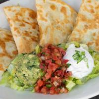 Steak Quesadilla · four tortilla filled with trio cheese, dice chicken, served with guacamole, and sour cream