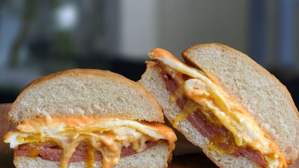  Ham Egg And Cheese Sandwich  · Slice  ham, 2 egg, melted American  cheese, salt, pepper and ketchup.