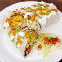 Chicken Burrito · Flour Tortilla, Citrus Garlic Marinated Chicken, Cheese, Beans, Rice, Pico de Gallo, Lettuce...