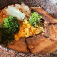 Spicy Miso Ramen · Sweet corn, cabbage, broccoli, scallion and pork belly chashu with ramen noodles.