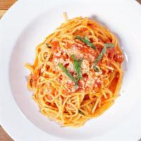 Spaghetti Pomodoro · San marzano tomatoes, basil, olive oil and parmigiano.