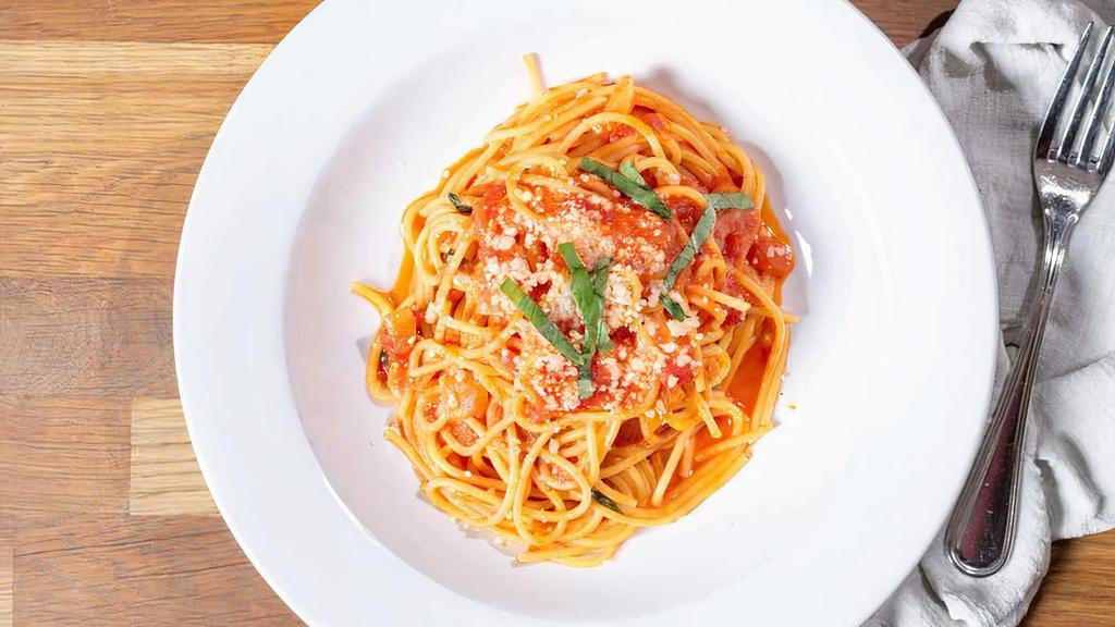 Spaghetti Pomodoro · San marzano tomatoes, basil, olive oil and parmigiano.