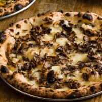 Funghi Pizza · Porcini cream sauce, mozzarella, parmigiana, crimini and matiake.