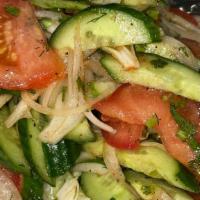 Fresh Salad  · Tomatoes, cucumbers, onions, mixed with dressing. 67.8 calories.