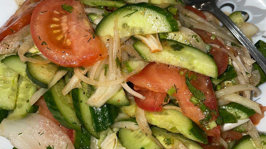 Fresh Salad  · Tomatoes, cucumbers, onions, mixed with dressing. 67.8 calories.