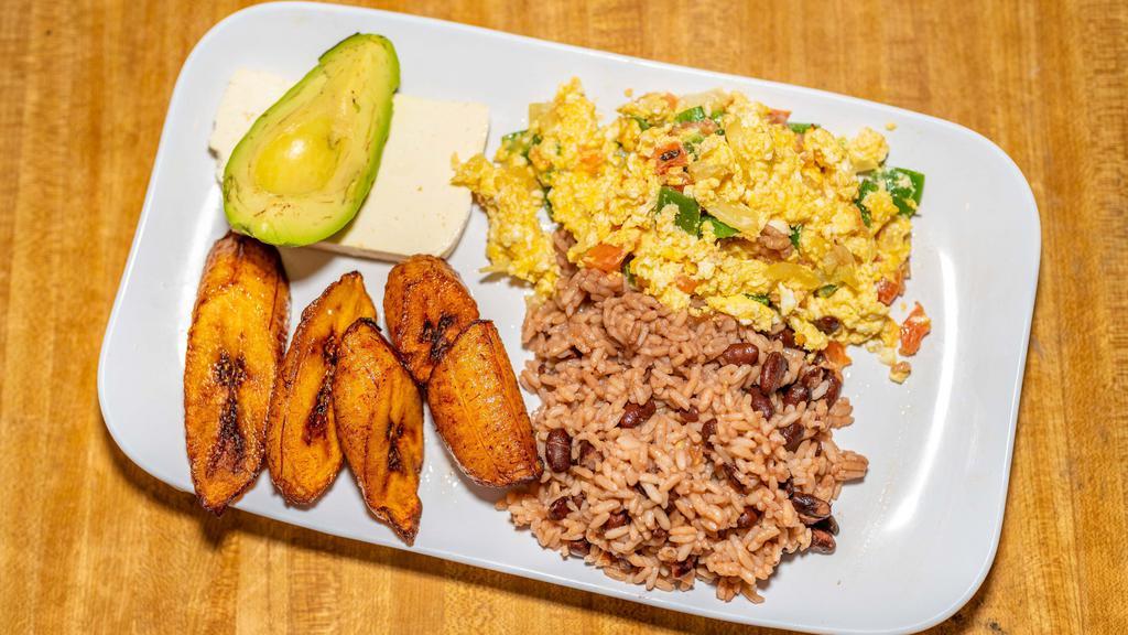 Desayuno De Tazumal / Tazumal Breakfast · Huevos revueltos con plátano, aguacate, casamiento y queso fresco. / Scrambled eggs with sweet plantains, avocado, rice, beans, and cheese.