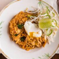 Pad Thai · Stir-fried Thai rice noodles with bean curd, eggs, bean sprouts, scallions, and crushed pean...