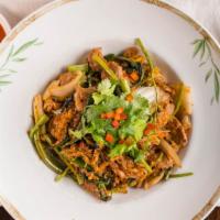 Spicy Sukhee Haeng · Stir-fried Thai sukiyaki with glass noodles, napa cabbage, Asian celery, eggs, scallions, on...