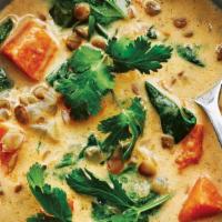 Green Curry · Spices and herbs blended in hot green chili paste with bamboo shoots, eggplants, basil and b...