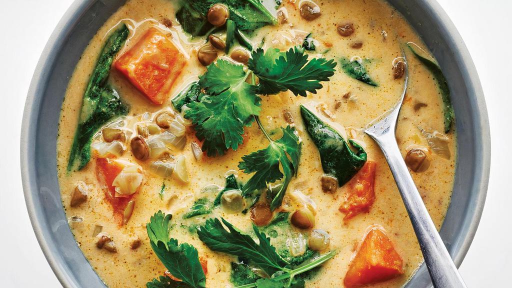 Green Curry · Spices and herbs blended in hot green chili paste with bamboo shoots, eggplants, basil and bell peppers, simmered in coconut milk.
