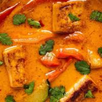Red Curry · Spices blended in chili paste with bamboo shoots, zucchini, basil and bell peppers, simmered...