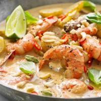 Massaman Curry · Thai-Muslim spices and herbs blended in chili paste with potatoes, peanuts and onions, simme...