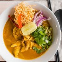 Chicken Chiang Mai Noodle · Red onions, lime, scallions, pickled cabbages, bean sprouts in a light yellow curry broth, t...
