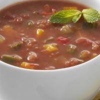 Gazpacho · A fresh cold soup with dice tomatoes, English cucumbers, Vidalia onions and bell peppers wit...