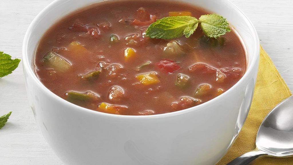 Gazpacho · A fresh cold soup with dice tomatoes, English cucumbers, Vidalia onions and bell peppers with extra virgin olive oil, balsamic vinegar and a dash of pepper sauce.