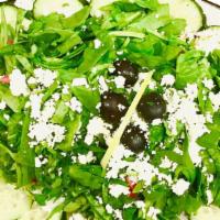 Greek Salad · Iceberg lettuce, cherry tomatoes, onion, spinach, feta cheese, olives.