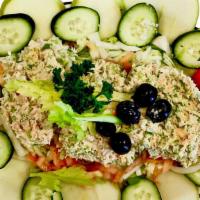 Tuna Salad · Fresh tuna, iceberg lettuce, cherry tomatoes, cucumbers, onion, apples, green pepper, dressi...