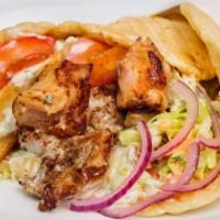 Chicken Shawarma Sandwich · Our chicken shawarma is marinated in Middle Eastern seasonings and slow-roasted throughout t...