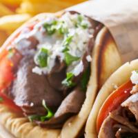 Gyro Sandwich · Beef and lamb gyro with seasonings and grilled to perfection. Filled with chopped salad, and...