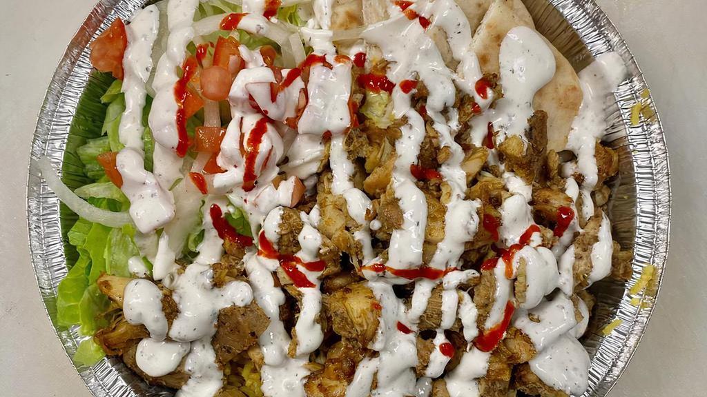 Chicken Shawarma Bowl Platter · Our chicken shawarma, rice, chopped salad and pita on the side.