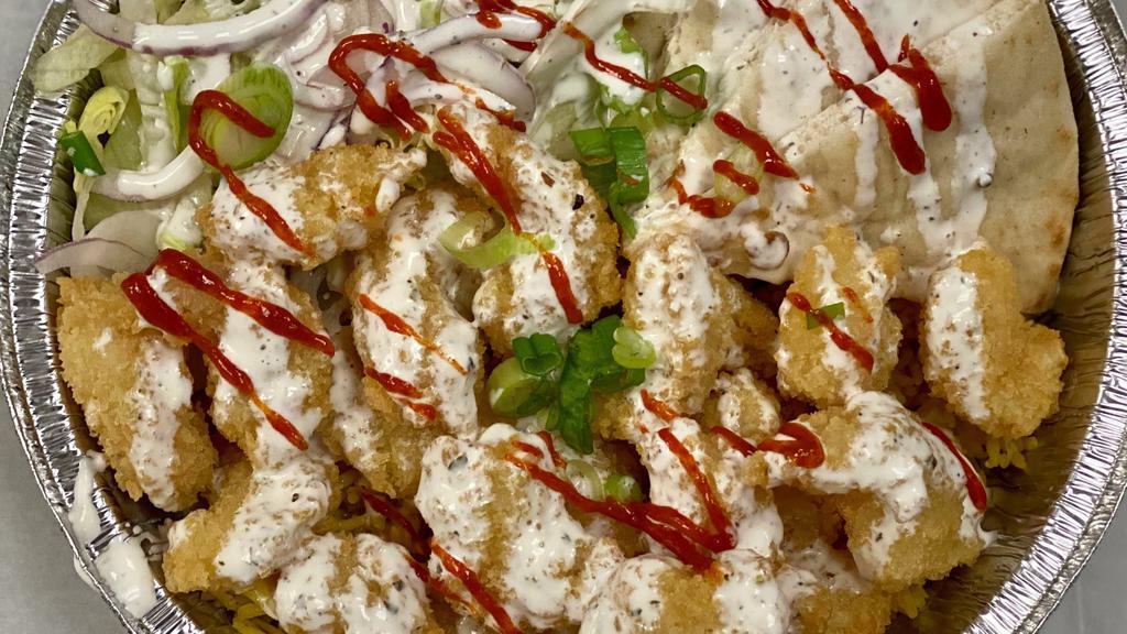 Shrimp Bowl Platter · Crispy fried shrimp on top of seasoned rice with lettuce, tomatoes, and pita