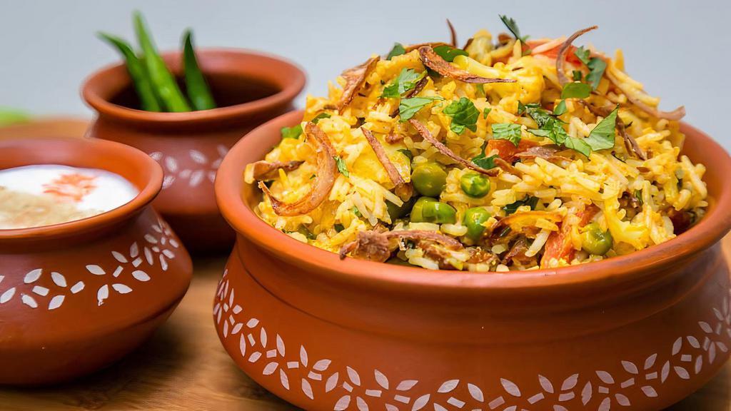 Vegetable Biryanni · Aromatic rice dish made by cooking basmati rice with mix veggies, herbs & biryani spices.