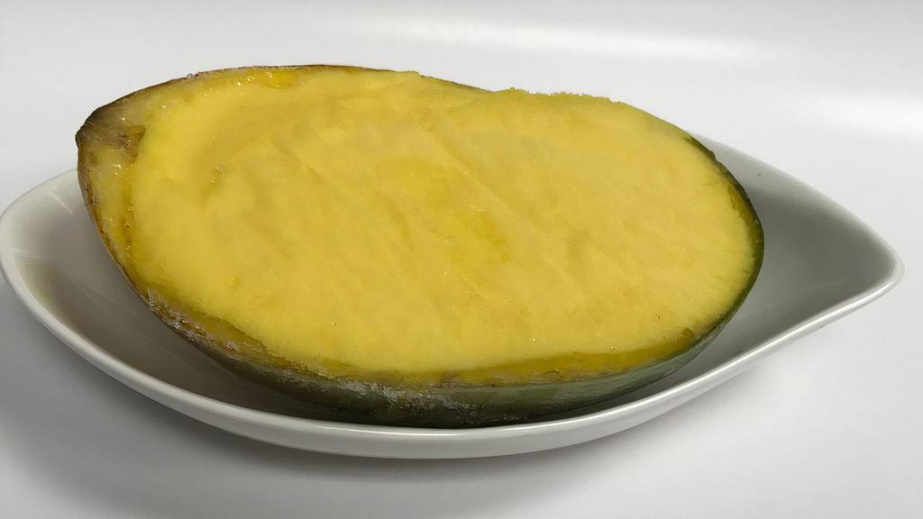 Mango Vegan Sorbet · Refreshing mango sorbet served in the natural fruit shell. (Frozen)