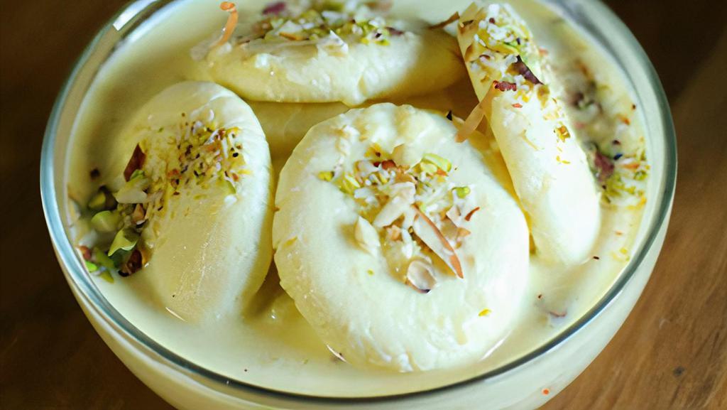 Rasmalai · Cottage cheese cake with out the crust, sweetened cream, pistachio flavored