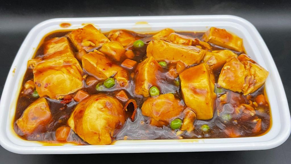 Ma Po Bean Curd · Spicy. Steam tofu with peas and carrot in spicy sauce.