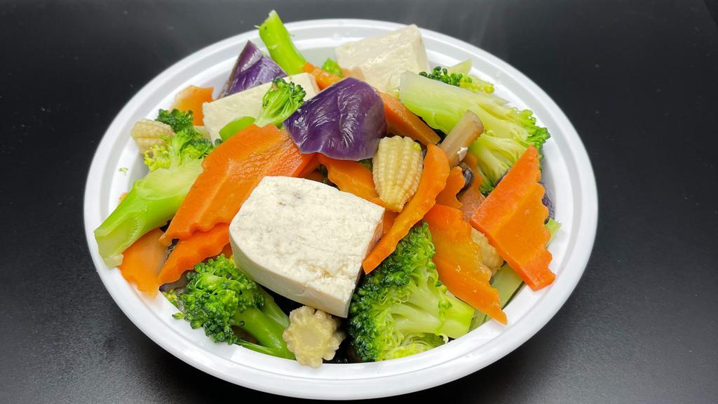 American Buddhist Delight · A healthful and colorful mixture of snow peas, broccoli, mushrooms, tofu, eggplant, carrots, baby corn.