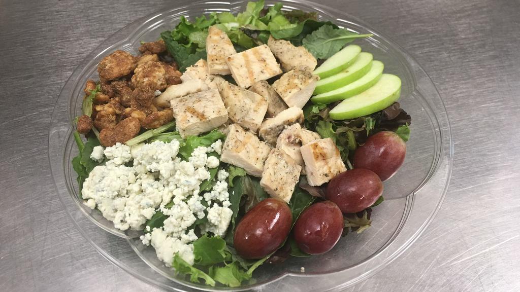 Waldorf Chicken Salad · Grilled chicken, field greens, chicken, grapes, Granny smith apples, candied walnuts, blue cheese crumbles & celery, served with homemade Dijon balsamic vinaigrette or blue cheese dressing.