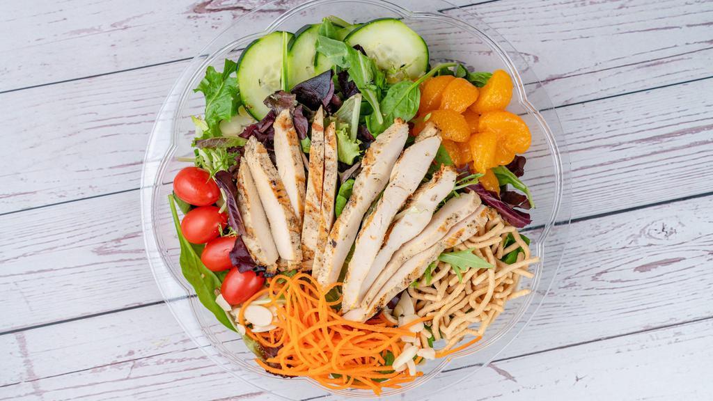 Asian Mandarin Chicken · Mixed greens, grilled chicken, grape tomato, cucumbers, carrots, mandarin oranges, almonds & crispy Chinese noodles with sesame ginger dressing.