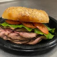 Roast Beef Sandwich · Roast beef muenster cheese lettuce onions and tomatoes.