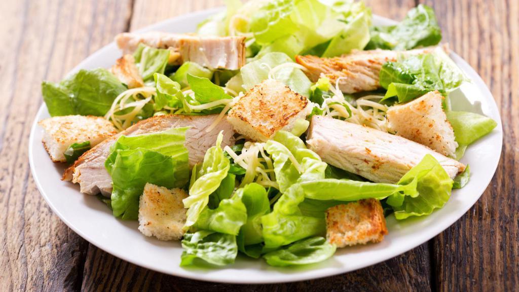 Caesar Salad · Fresh salad with romaine lettuce, cherry tomatoes, parmesan cheese and homemade croutons with a creamy dressing.