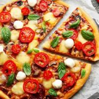 Genovese Pizza · Rivera style pizza made with fresh sweet basil, pesto and fresh mozzarella cheese.