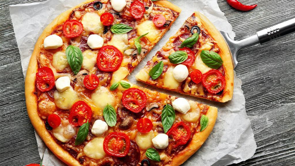 Genovese Pizza · Rivera style pizza made with fresh sweet basil, pesto and fresh mozzarella cheese.