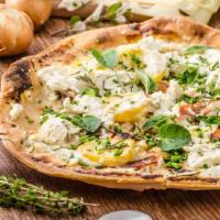 Pizza Bianca · Fresh blend of Parmigiana Reggiano, ricotta, mozzarella cheese, garlic, and herbs.