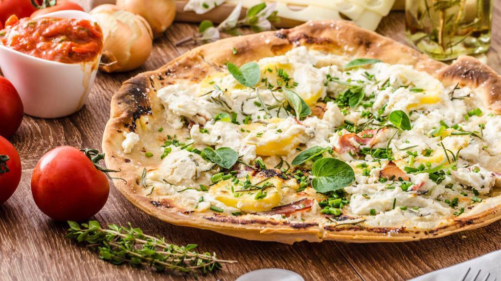 Pizza Bianca · Fresh blend of Parmigiana Reggiano, ricotta, mozzarella cheese, garlic, and herbs.