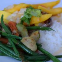 Julia Chop · Tender chop served with our spicy mango sauce served with coconut rice and fresh veggies.