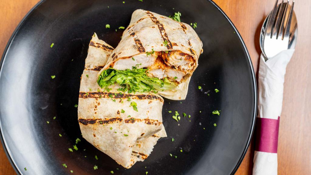 Chicken Wrap With 1 Side · Stuffed with grilled chicken marinated in our special marinade, lettuce, salsa sauce, mayonnaise and Monterey Jack cheese. Served with your choice of sauces in tortilla bread.