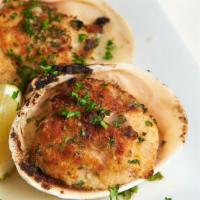 Baked Stuffed Clams Casino · Chopped clams baked with seasoned breadcrumbs and garlic white wine sauce