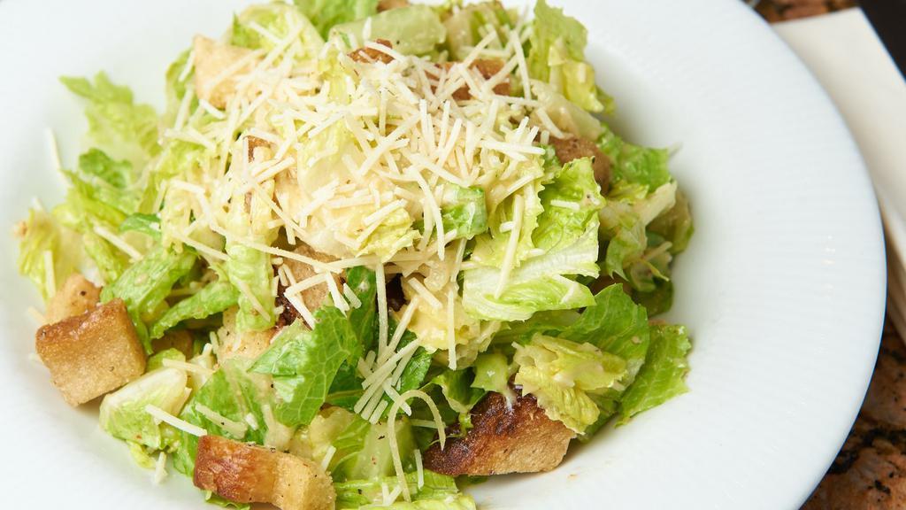 Classic Crispy Caesar Salad · Crisp romaine lettuce, herb croutons, grated parmesan cheese & caesar dressing