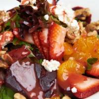 Beet Goat Cheese Salad · Tossed mesclun greens, baby spinach, sliced strawberries, beets, walnuts, mandarin segments,...