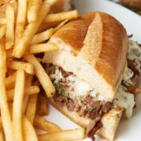 Steakhouse Mozzarella Sandwich · Sautéed steak, onions, and mushrooms topped with fresh melted mozzarella cheese on a hero wi...